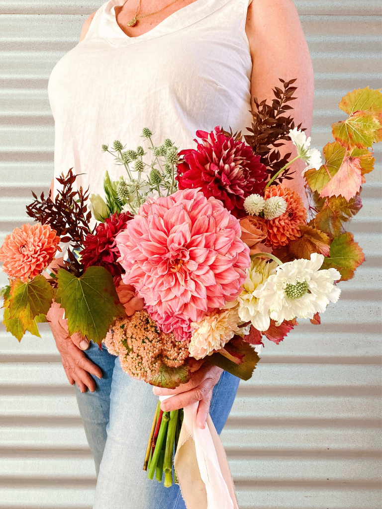 A beautiful wedding bridal bouquet using show standard Dahlia flowers. Designed by Tania Guest, local florist from The Seasonal Bunch in Happy Valley, SA. Design name ‘Summer Passion’