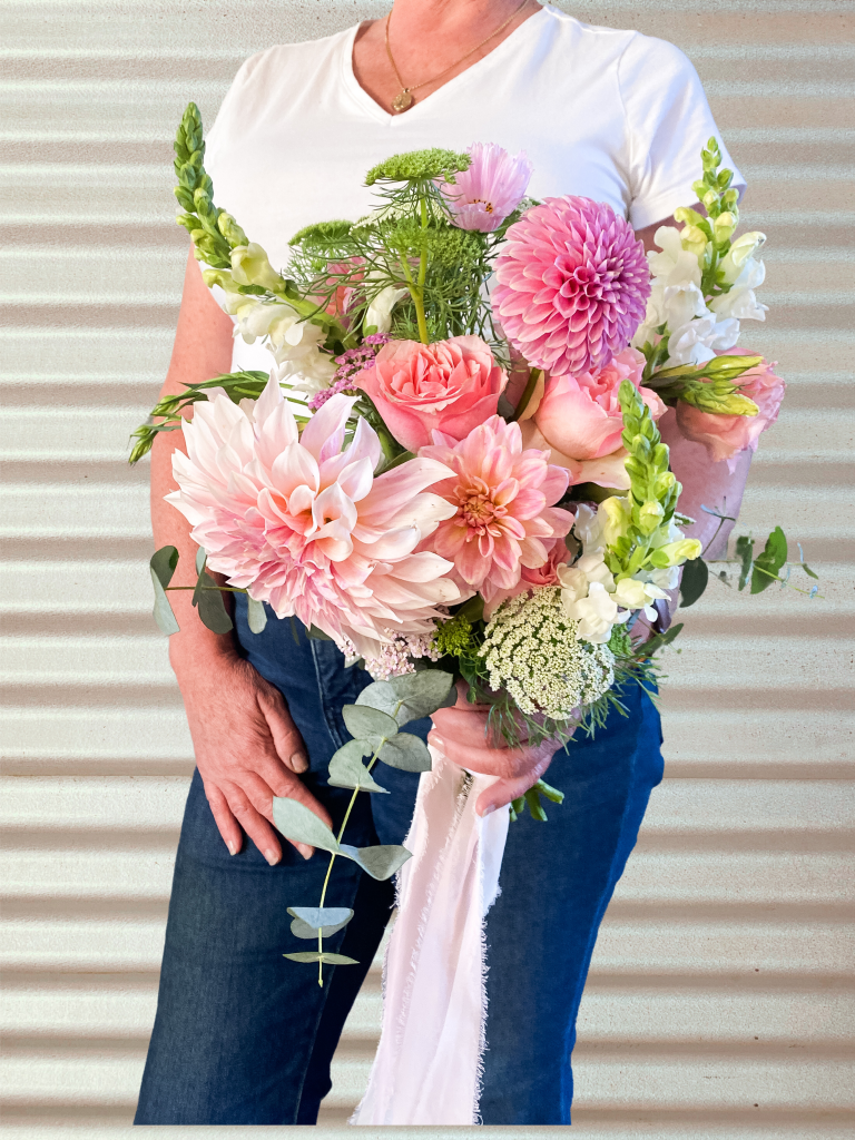 A beautiful wedding bridal bouquet using show standard Dahlia flowers. Designed by Tania Guest, local florist from The Seasonal Bunch in Happy Valley, SA. Design name ‘Autumn Whispers'