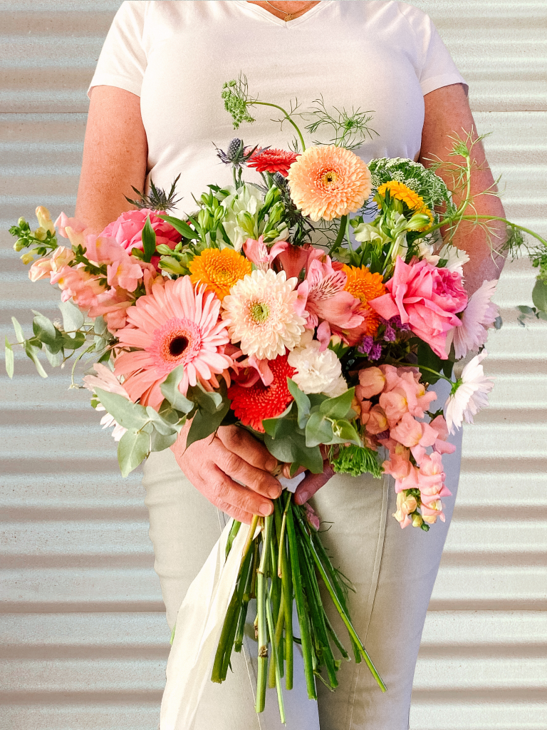 A beautiful wedding bridal bouquet using autumn garden flowers. Designed by Tania Guest, local florist from The Seasonal Bunch in Happy Valley, SA. Design name ‘Autumn Garden'