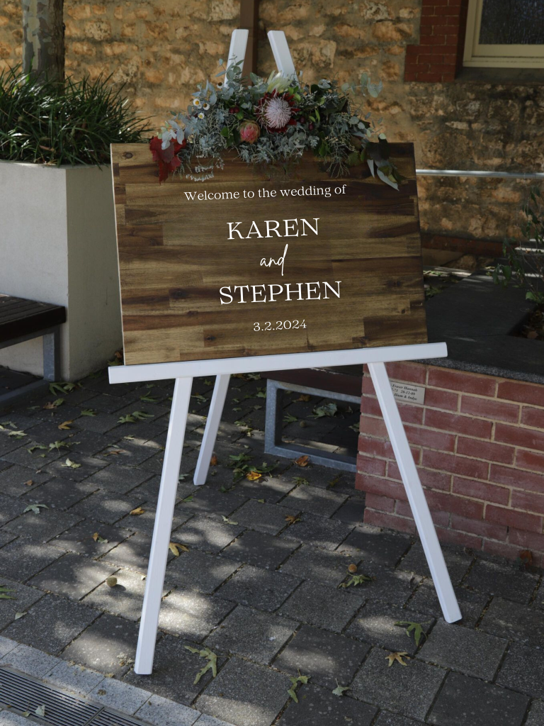 A stylishly beautiful Board and Easel Welcome sign for weddings and other special occasions, with laser cut acrylic lettering and florals to suit your aesthetic from The Seasonal Bunch florist in Happy Valley SA